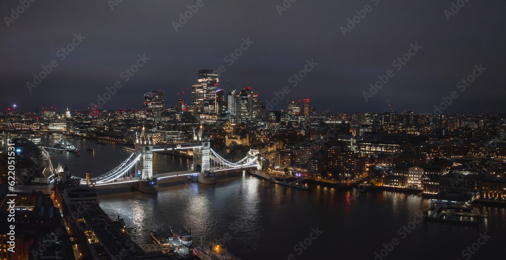 Aerial night view of the Tower Bridge in London. Beautiful illuminated panorama of London Tower Bridge.