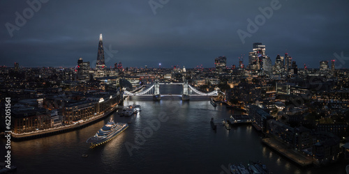 Aerial night view of the Tower Bridge in London. Beautiful illuminated panorama of London Tower Bridge at night.