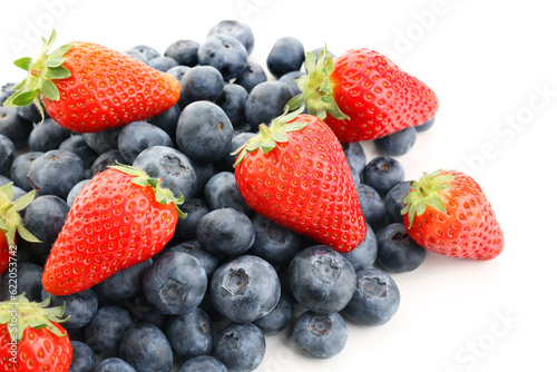 Ripe strawberry and blueberry on white background, closeup