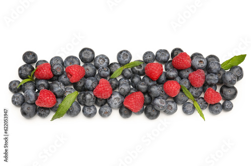 Ripe raspberry and blueberry on white background