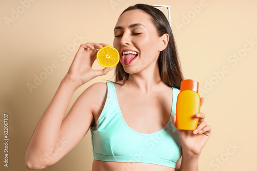 Young woman with orange hal...