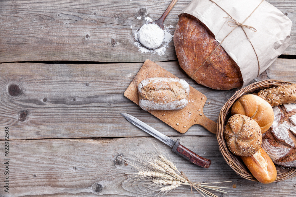 Delicious freshly baked bread on wooden background Delicious freshly baked bread on wooden background