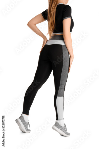 Young woman in sportswear on white background