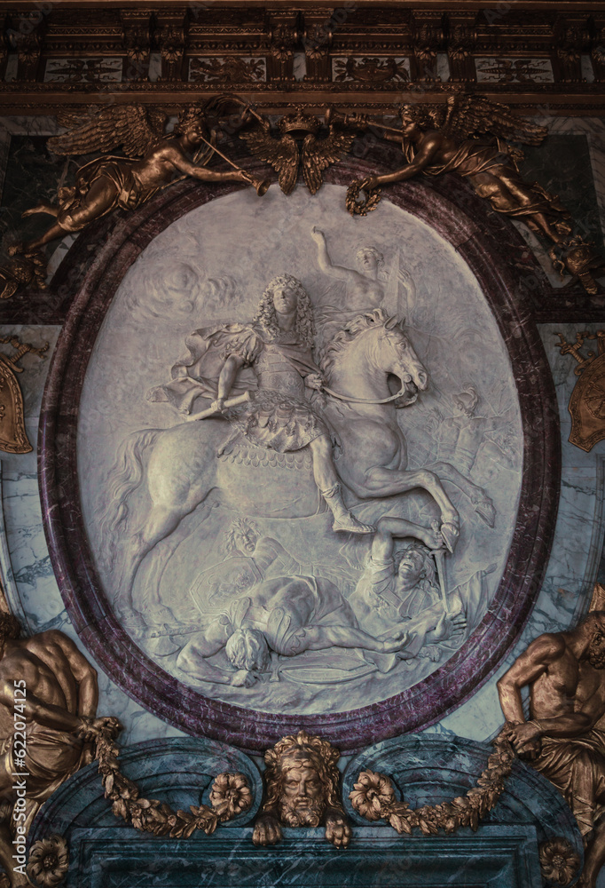 King Louis also called the sun king carved riding a horse and defeating his rivals