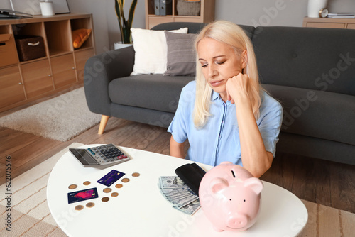 Upset mature woman counting...