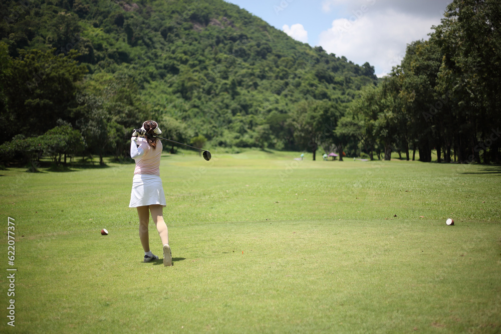 girls is playing golf on a sunny day girls is playing golf on a sunny day