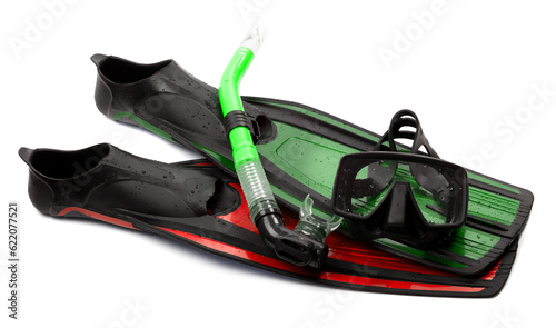 Mask, snorkel and flippers of different colors with water drops. Diving gear on white background.