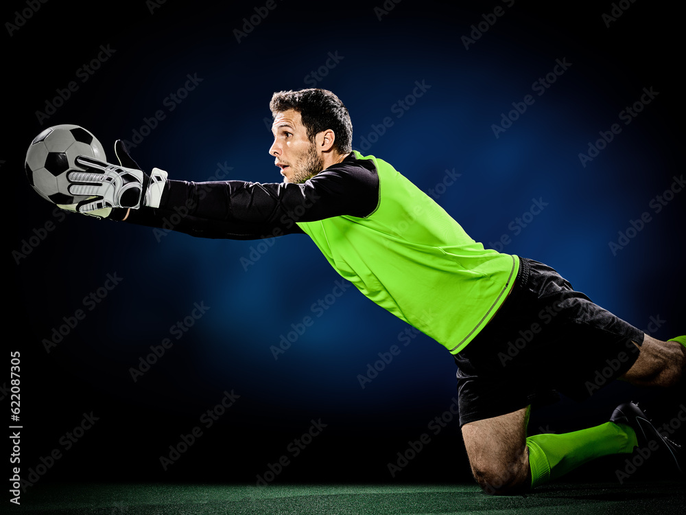 one caucasian goalkeeper soccer man isolated on black background one caucasian goalkeeper soccer man isolated on black background