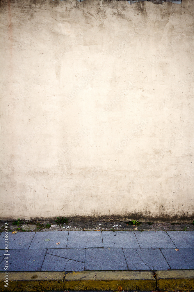 Old yellow street wall and pavement Old yellow street wall and pavement