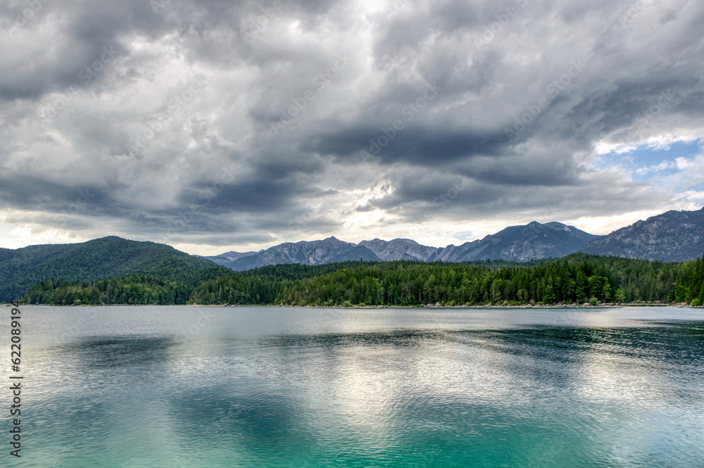 View at Lake Eibsee near Garmisch Partenkirchen, Bavaria, germany, in summer at a misty late afternoon View at Lake Eibsee near Garmisch Partenkirchen, Bavaria, germany, in summer at a misty late afternoon