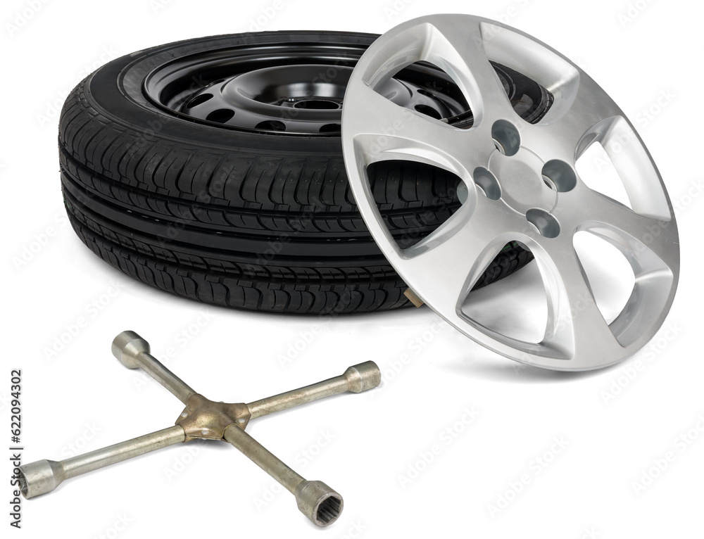 Obraz premium Car service. Car tyre with wheel cap and screwdriver. Isolated