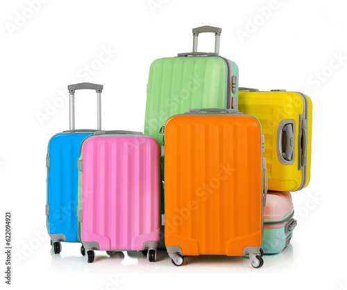 Multi-colored suitcases isolated on white