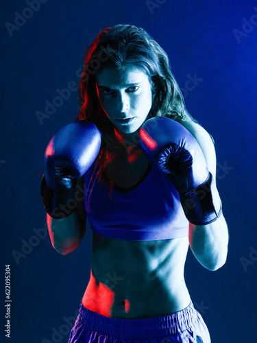one caucasian woman boxer boxing isolated on black background