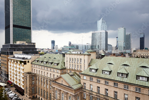 Old residences and modern office buildings at Warsaw city center. Cloudy Day.