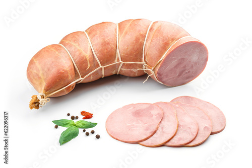 Fototapeta Naklejka Na Ścianę i Meble -  Stick of boiled pork sausage, sliced smoked ham, gammon with spices and fresh herbs isolated on white background. Meat boiled sausage, top view
