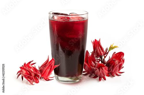 Roselle juice in glass
with roselle flowers isolated on white background.