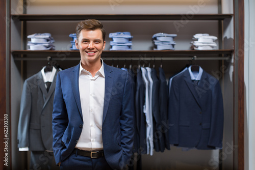 Smiling young man in store