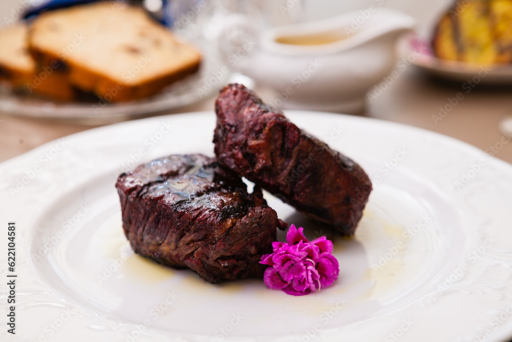 Filet mignon served on a plate in restaurant Filet mignon served on a plate in restaurant
