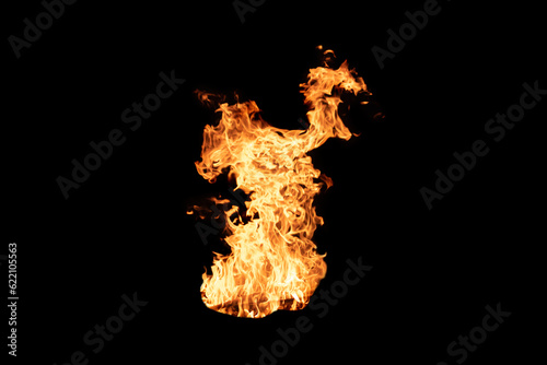 Fire flame burning isolated on dark background. Abstract fireplace burning light on black backdrop. Intense hot fire