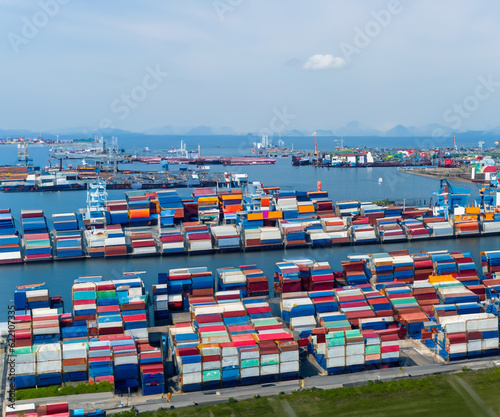 a wide and high angle view of sea port with many container, busy port