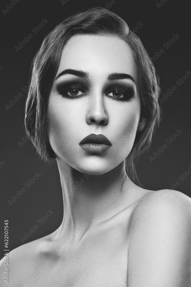 Beautiful young woman with smoky eyes and full red lips. Studio beauty shot. Copy space. Beautiful young woman with smoky eyes and full red lips. Studio beauty shot. Copy space.