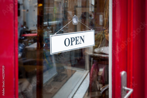 An image of an open sign at the shop door