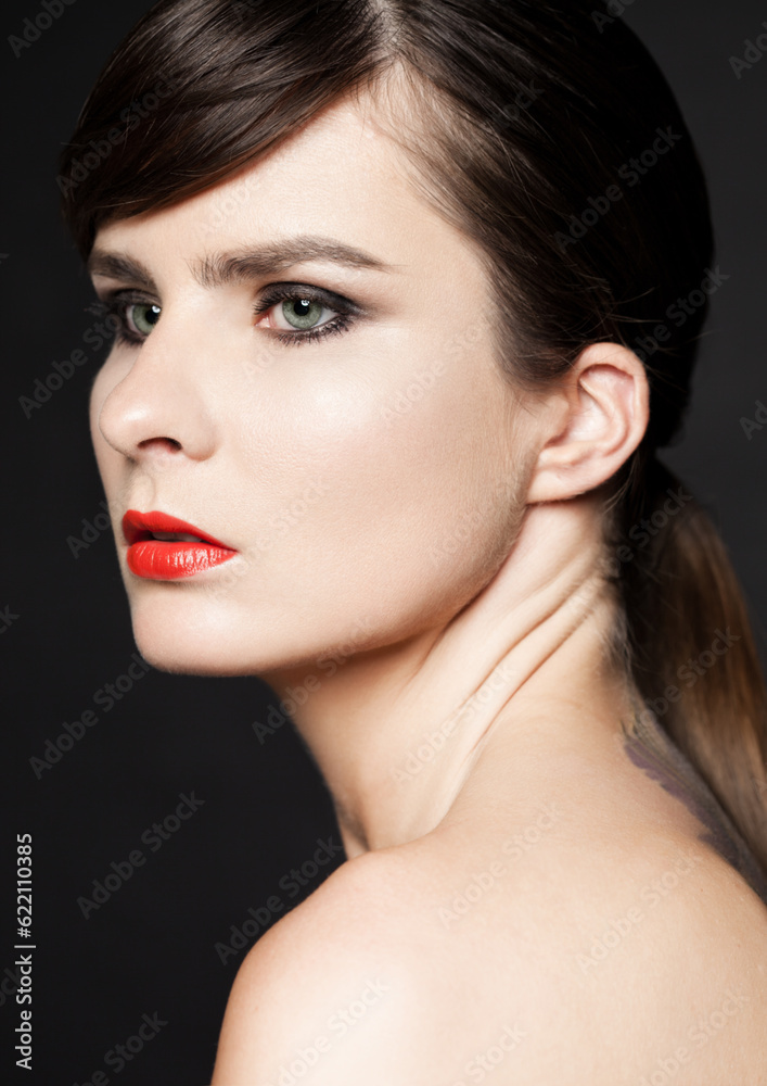 Beauty woman with red lips and smokey eyes on black background. Natural portrait. Healthy leaving. Classic photography Beauty woman with red lips and smokey eyes on black background. Natural portrait. Healthy leaving. Classic photography