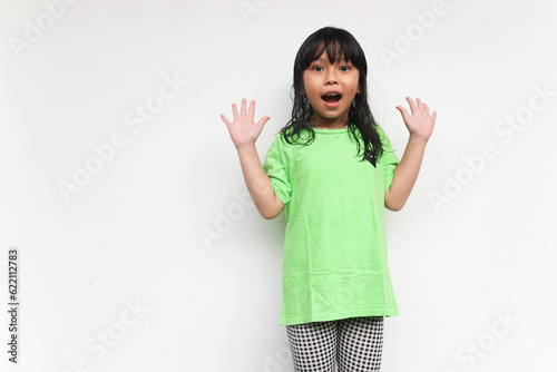 Portrait of surprised happy beautiful girl looking at camera in excitement