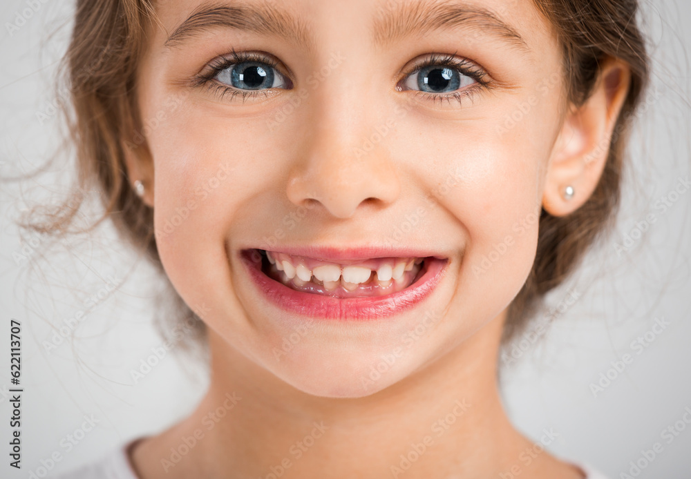 Studio portrait of a beautiful and happy girl smiling Studio portrait of a beautiful and happy girl smiling