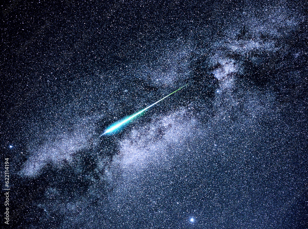 Naklejka premium A meteor streaks across the Milky Way during the Perseid meteor shower of 2016.