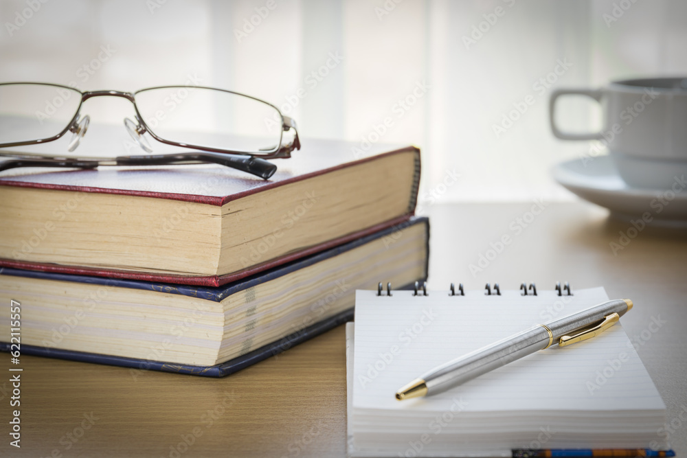 Pen put on notepad open blank page on wood table Pen put on notepad open blank page on wood table