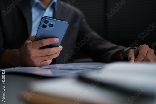 Photography Young man surfing social media or texting messages on mobile phone