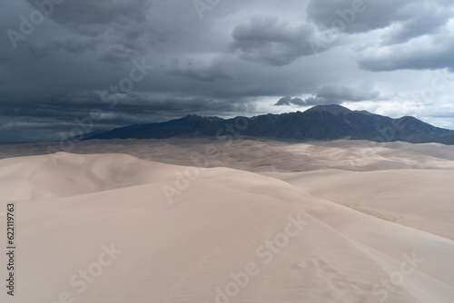 Epic mountain and sand dunes with a storm approaching