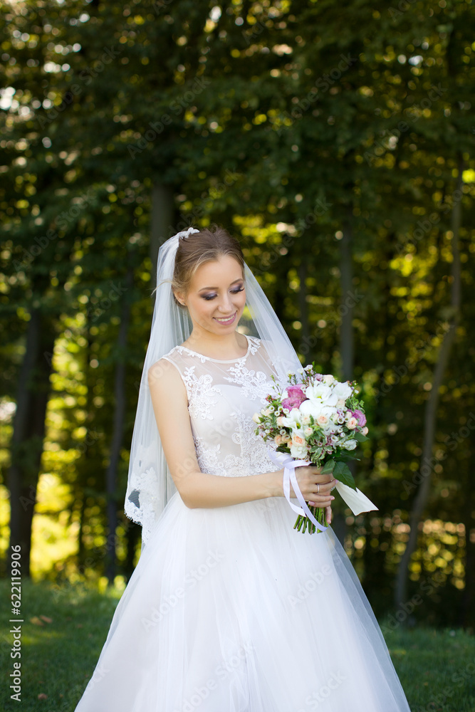 Close up of big bunch of fresh white roses and tulips flowers in female hands. Close up of big bunch of fresh white roses and tulips flowers in female hands.