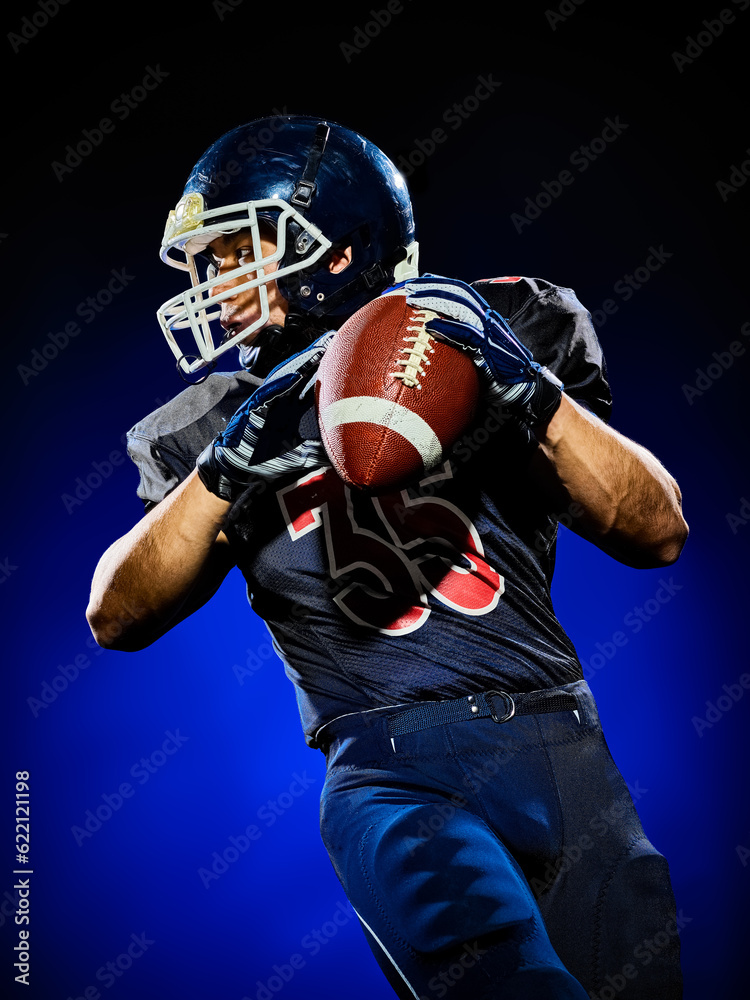 one american football player man isolated on colorful black background one american football player man isolated on colorful black background