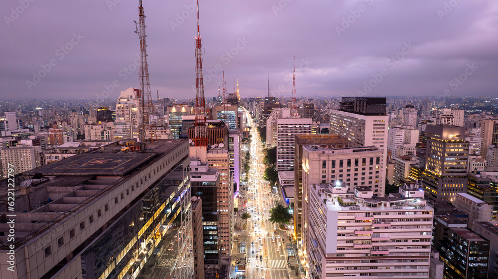 Fototapeta premium Aerial view of Av. Paulista in Sao Paulo, SP. Main avenue of the capital. Photo at night, with car lights.