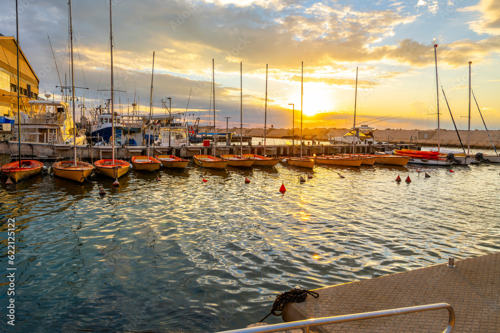 Small boats in the marina at sunset at the ancient port city of Old