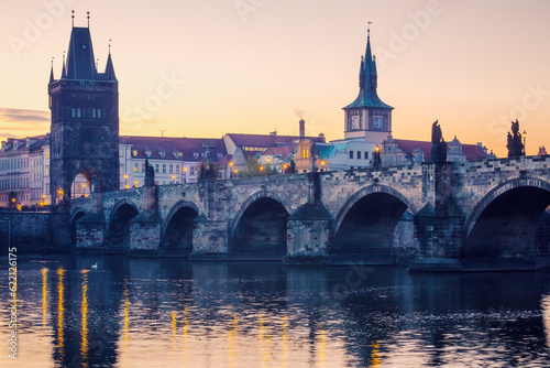 Prague city sunrise over Charles Bridge on Vltava river, Czech Republic