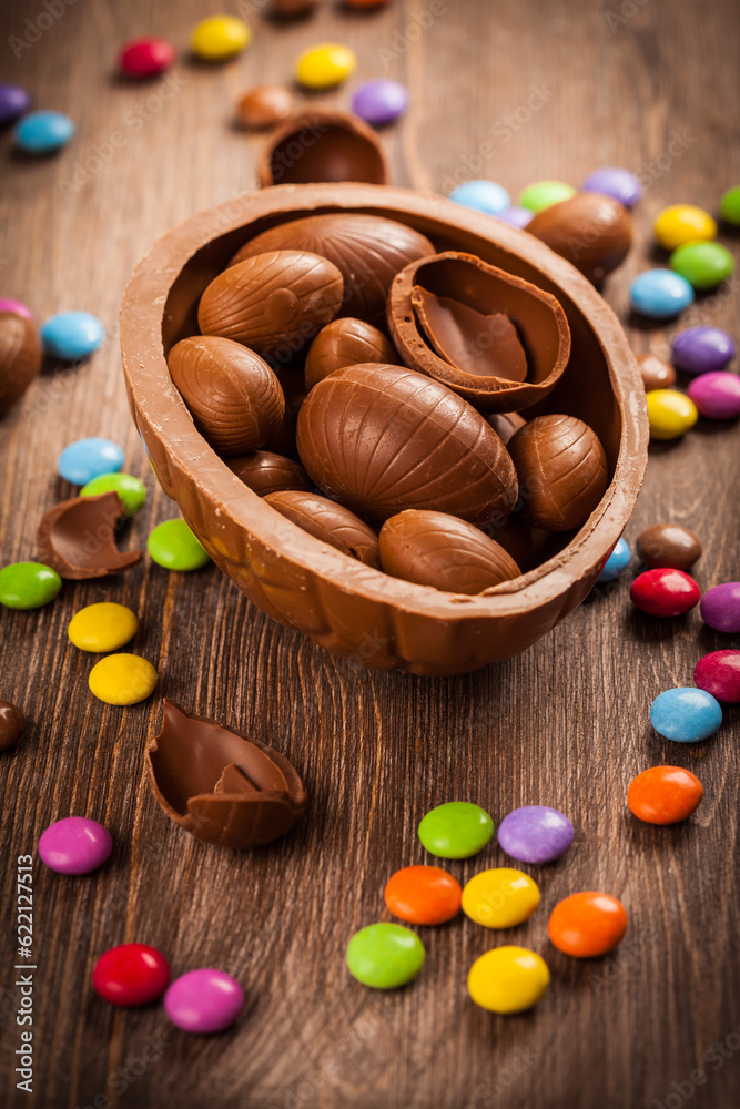 Assorted chocolate for Easter on wooden background