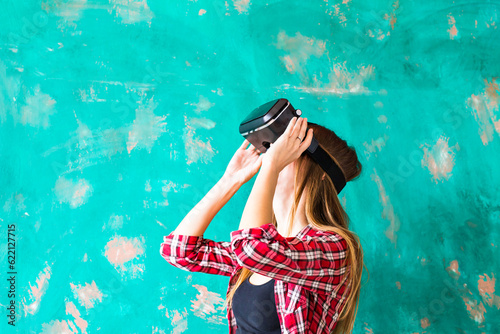 Woman in virtual reality headset enjoying her experience. © Designpics