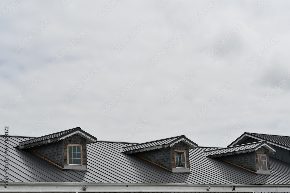 Dormer style roof with three windows.