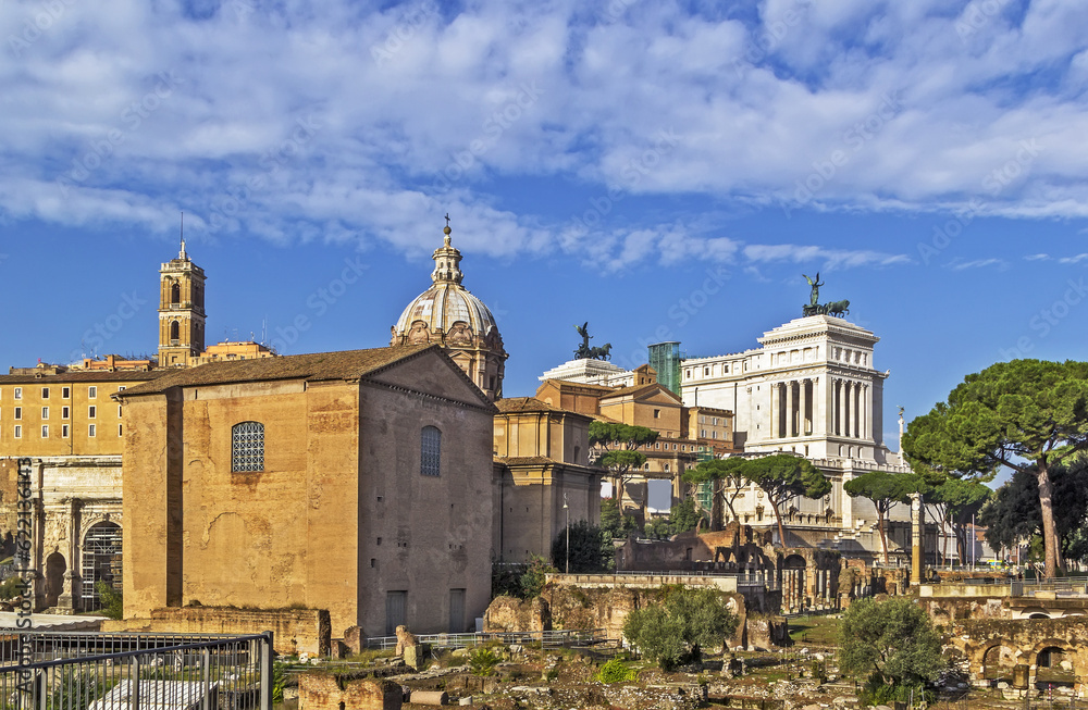 The Roman Forum is a rectangular forum (plaza) surrounded by the ruins of several important ancient government buildings at the center of the city of Rome. Curia and Santi Luca e Martina church