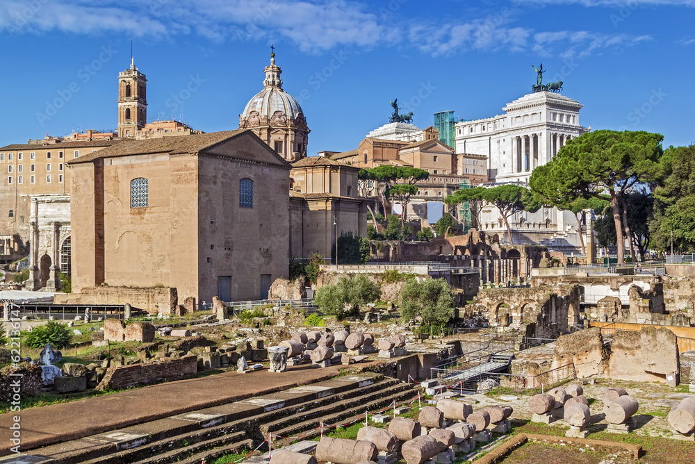The Roman Forum is a rectangular forum (plaza) surrounded by the ruins of several important ancient government buildings at the center of the city of Rome. Curia and Santi Luca e Martina church