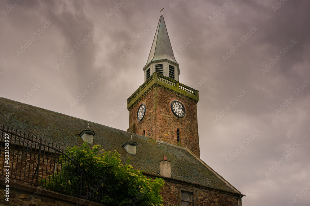 2023-0-6-11 A OLD BRICK BUILDING WITH A BRICK STEEPLE AND TWO CLOCK FACES WITH A CLOUDY SKY IN INVERNESS SCOTLAND 2023-0-6-11 A OLD BRICK BUILDING WITH A BRICK STEEPLE AND TWO CLOCK FACES WITH A CLOUDY SKY IN INVERNESS SCOTLAND