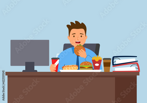 Man eating while working in front of computer. Fat hungry man working in office.
