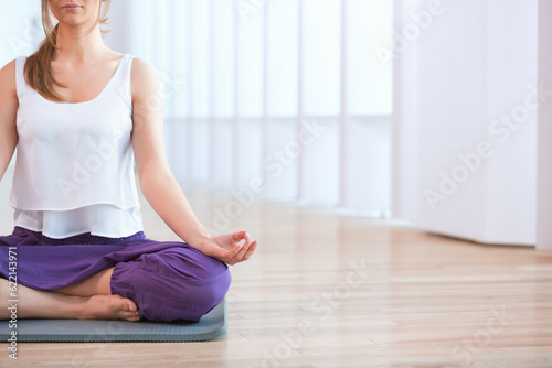 Young woman in lotus position