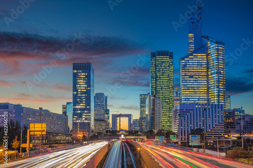 Image of office buildings in modern part of Paris- La Defense during beautiful sunset. photo