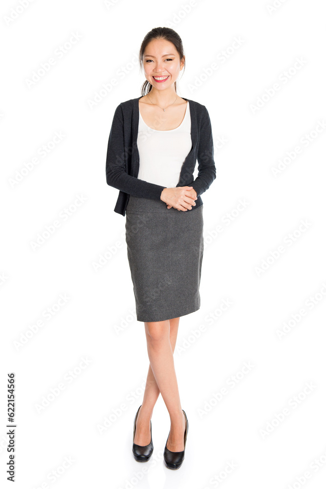 Full length portrait of young Asian girl smiling, standing isolated on white background. Full length portrait of young Asian girl smiling, standing isolated on white background.