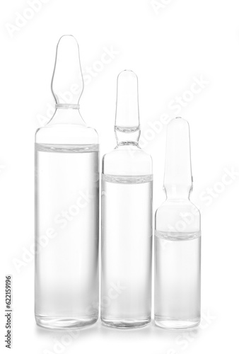 Medical ampules on white ba...