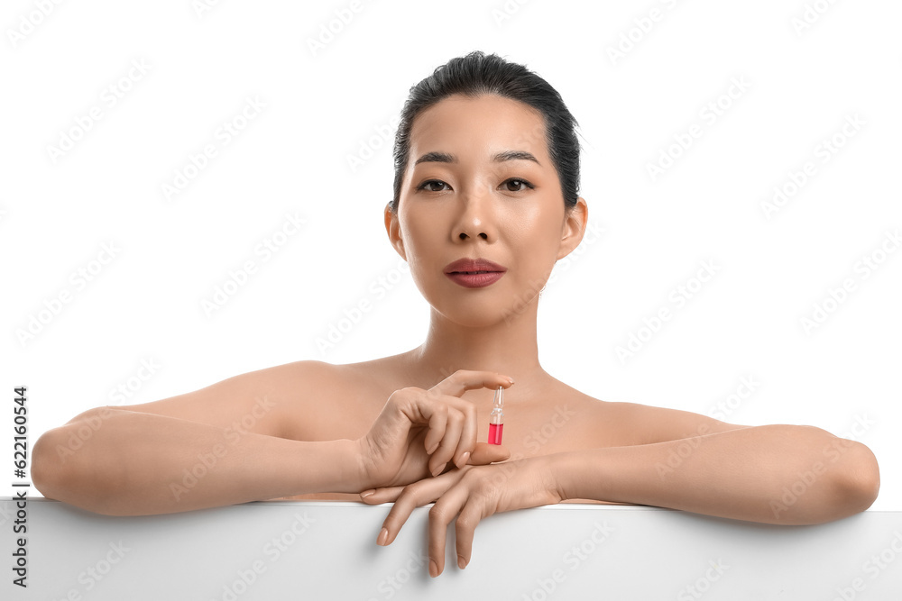 Beautiful Asian woman with ampule on white background. Skin care concept Beautiful Asian woman with ampule on white background. Skin care concept